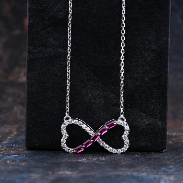 Infinity Shape Pendant With Red Ruby and round Moissanite necklace